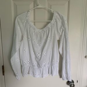 White Top with embroidery and small cut outs.